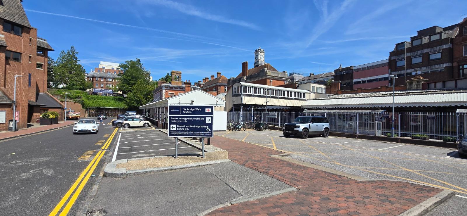 Tunbridge Wells Station car park with the station building and clock tower visible on a sunny day
